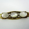 Broche en nacre dorée vintage